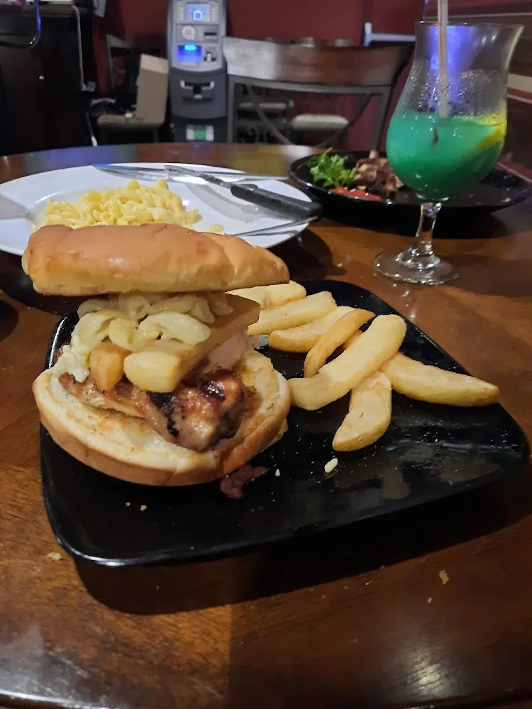 1 2 Pound Pork Chop Sandwich with Mac and Cheese an Frys on Top